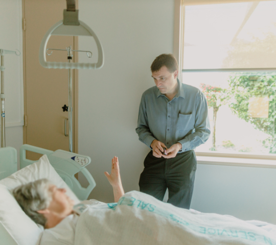 Dr Brooker consulting with patient