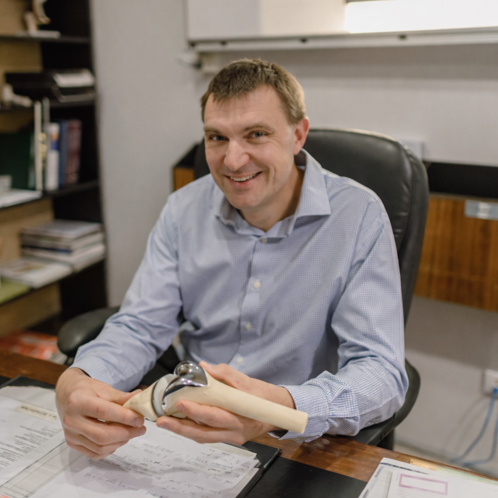 Dr Brooker at desk for telehealth